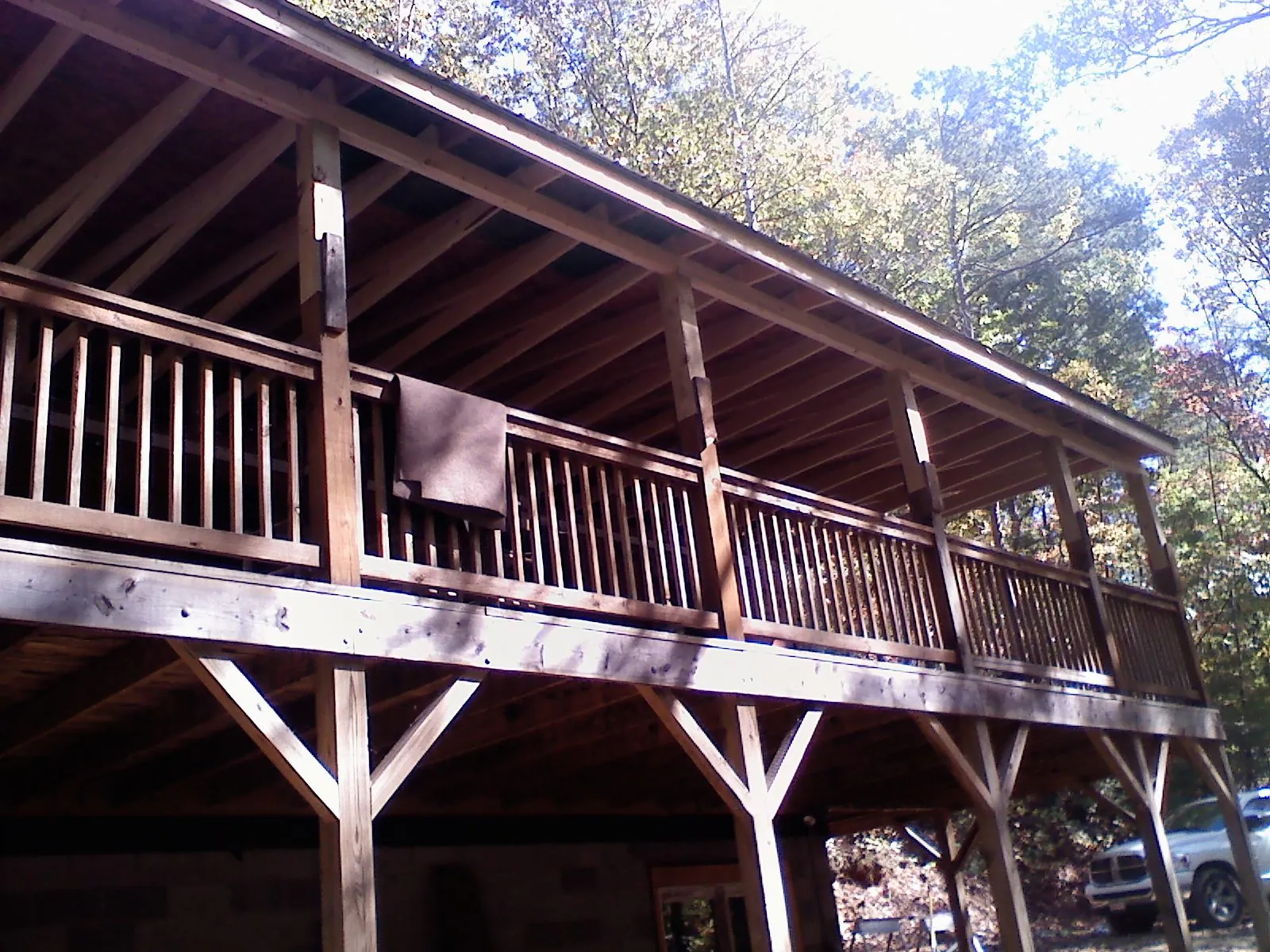 Timber framing under a new elevated porch and deck — Roof Leak Repair in Durango by Roofing Brothers